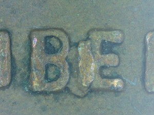 1975 penny BIE die crack error showing raised vertical line between B and E in LIBERTY